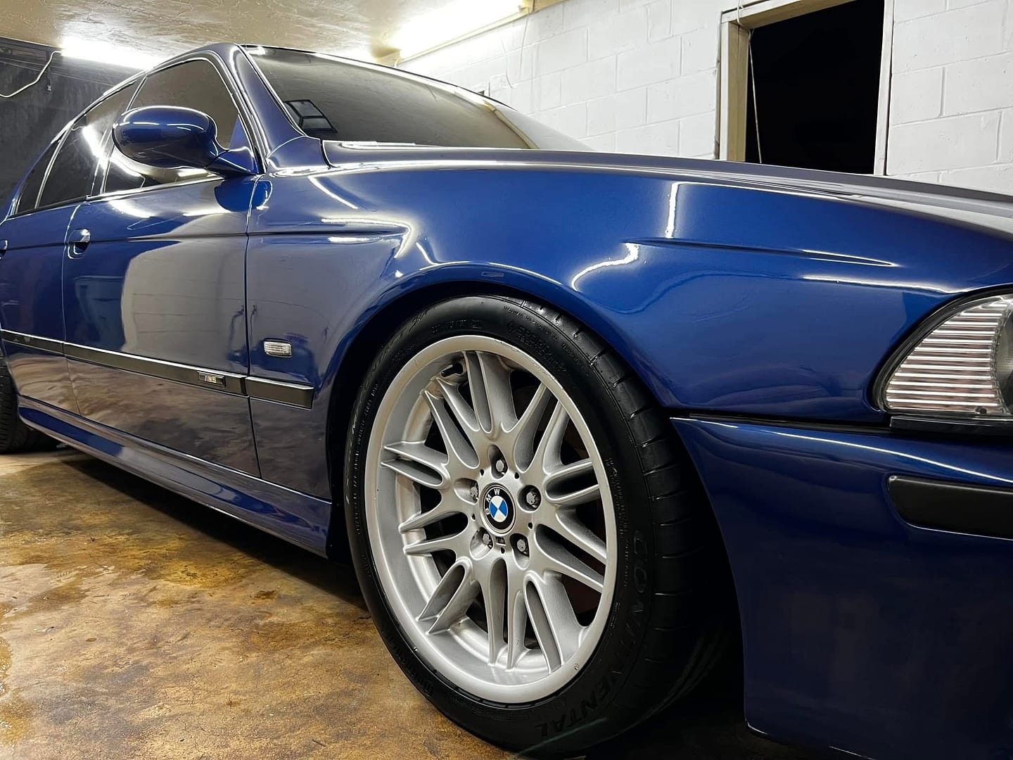 Car ceramic coating performed in Tallahassee, FL by Seminole Mobile Detailing on a blue BMW.
